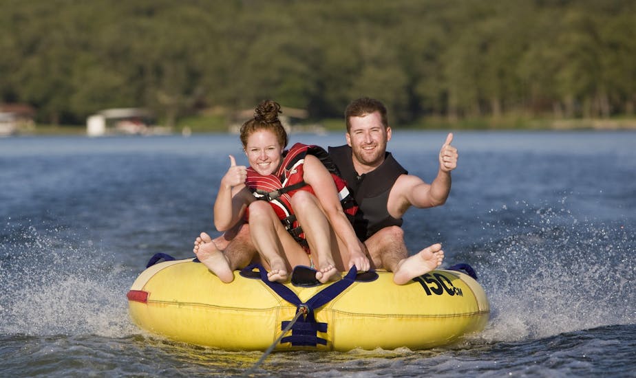 Couple is having fun on an inflatable tube