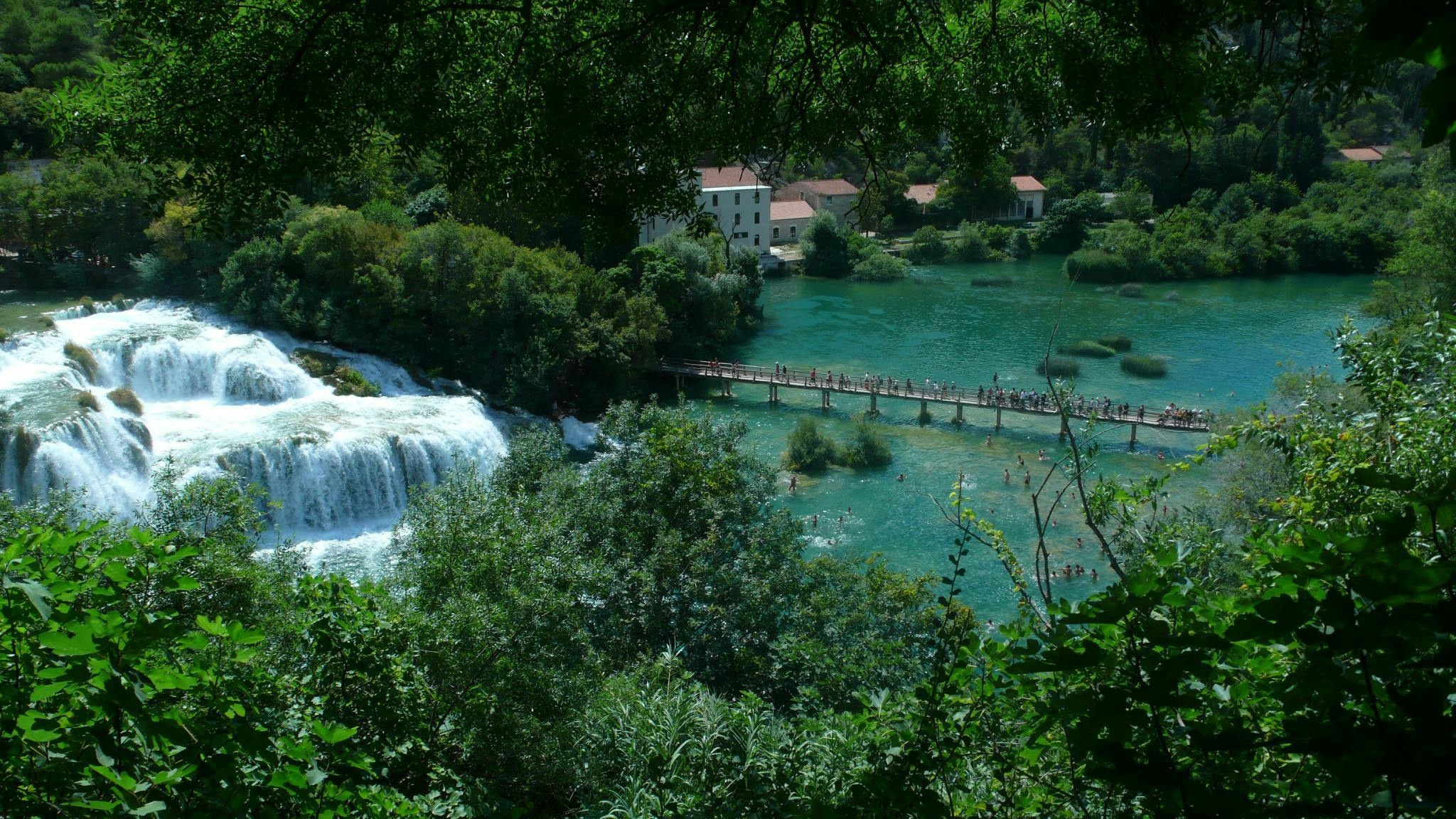 Jadera Booking Zadar Group of people doing a tour through Krka National Park with Jadera Booking Zadar.