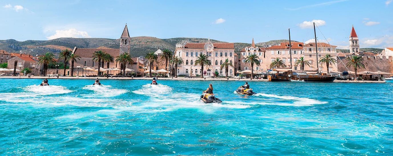 A group of friends is exploring the coast of Trogir with Jet Skis from Jetski Safari Trogir.