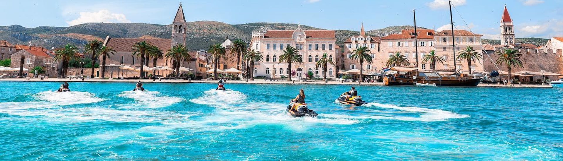 A group of friends is exploring the coast of Trogir with Jet Skis from Jetski Safari Trogir.