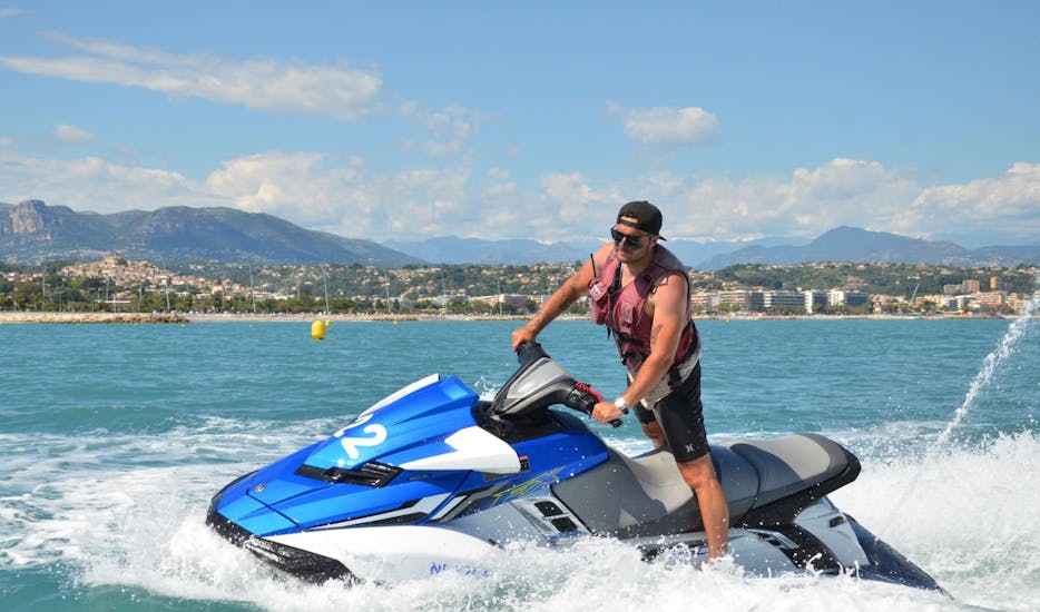 A man is enjoying a jet ski ride in the Villeneuve-Loubet bay thanks to Jet 27 who offers water sports activities on the French Riviera.