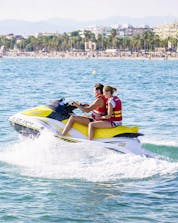 Two friends enjoy the jet ski tour in the pleasant sea together with Estació Nàutica Costa Daurada during the Jet Ski Rental in Salou or Cambrils.