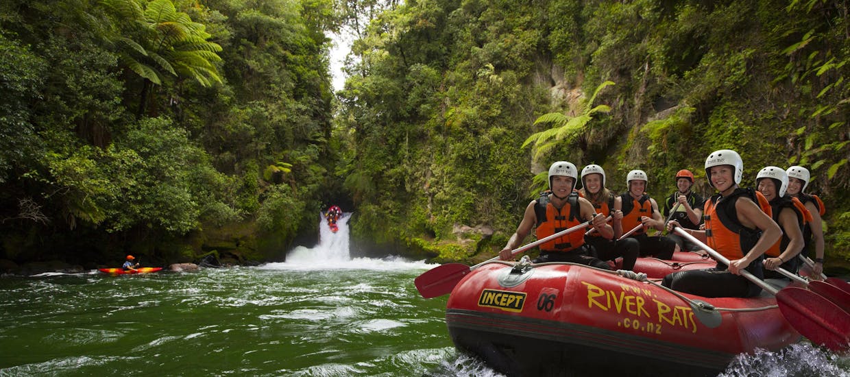 A group of rafters is enjoying the ride on the river together with River Rats Rotorua Raft & Kayak. 