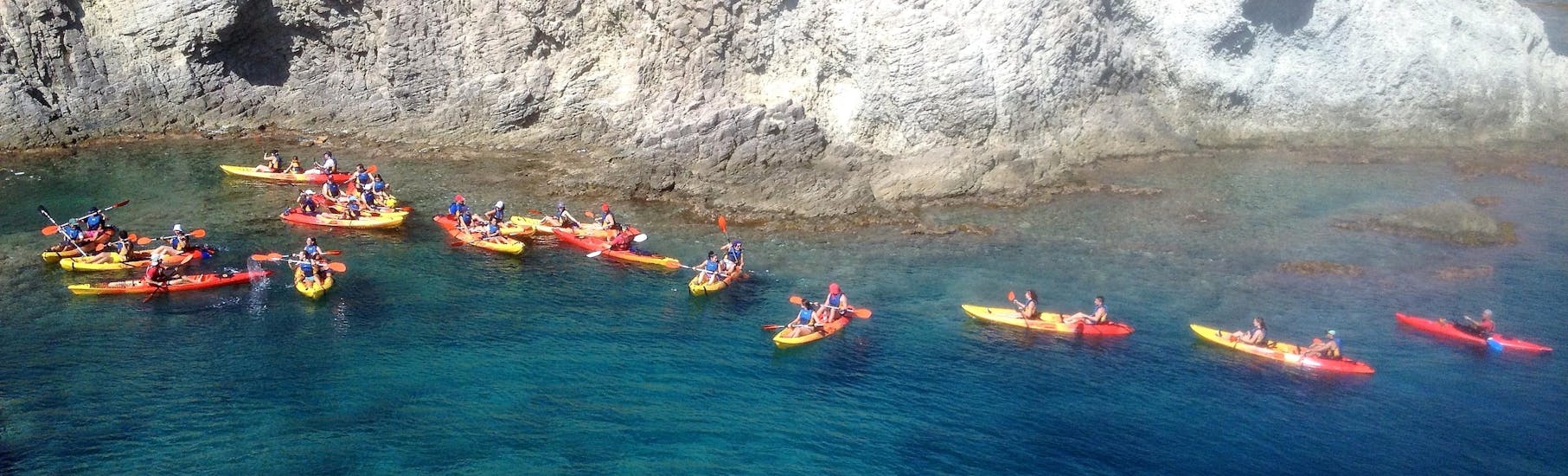 People kayaking towards the cave of Cabo de Gata.