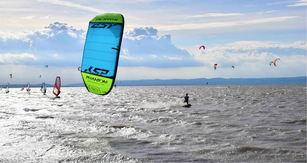 People are kitesurfing at the Lake Neusiedl