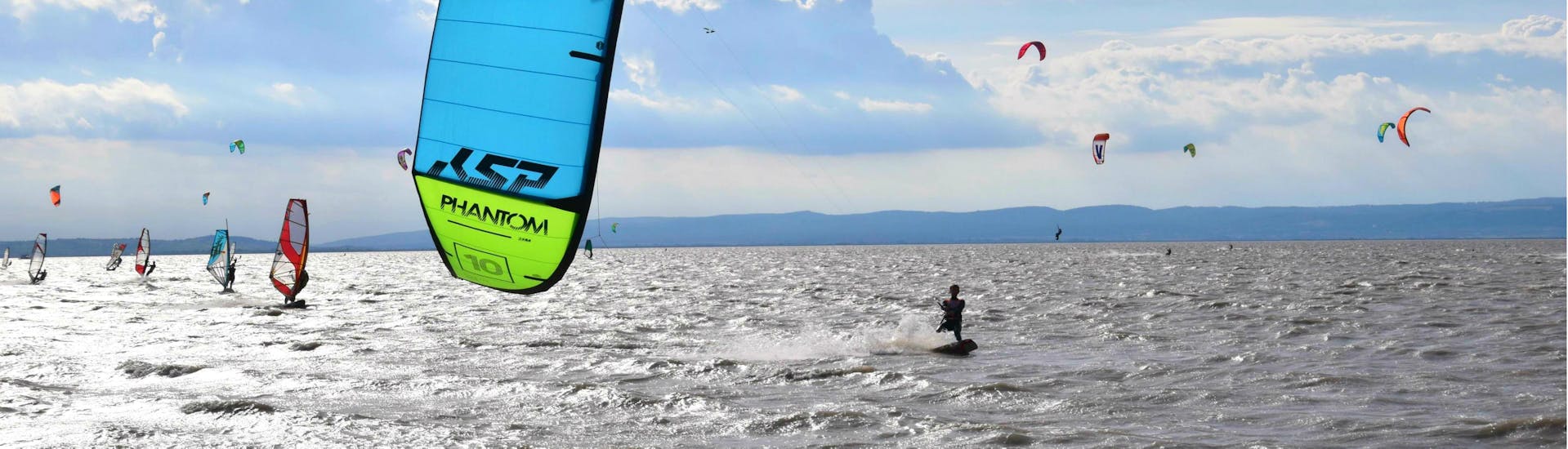 People are kitesurfing at the Lake Neusiedl