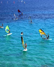 A group of windsurfers enjoying the beautiful weather on the ocean where you can do windsurfing and kitesurfing on the Brac Island.