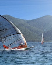 Several surfers are competing against each others in a race where you can do windsurfing and kitesurfing in Pelješac.