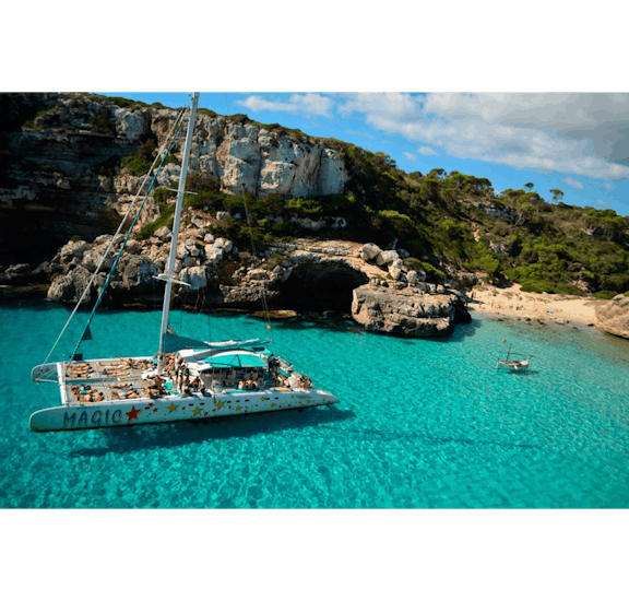 A Magic Catamarans catamaran floating in a beautiful Majorcan bay. 