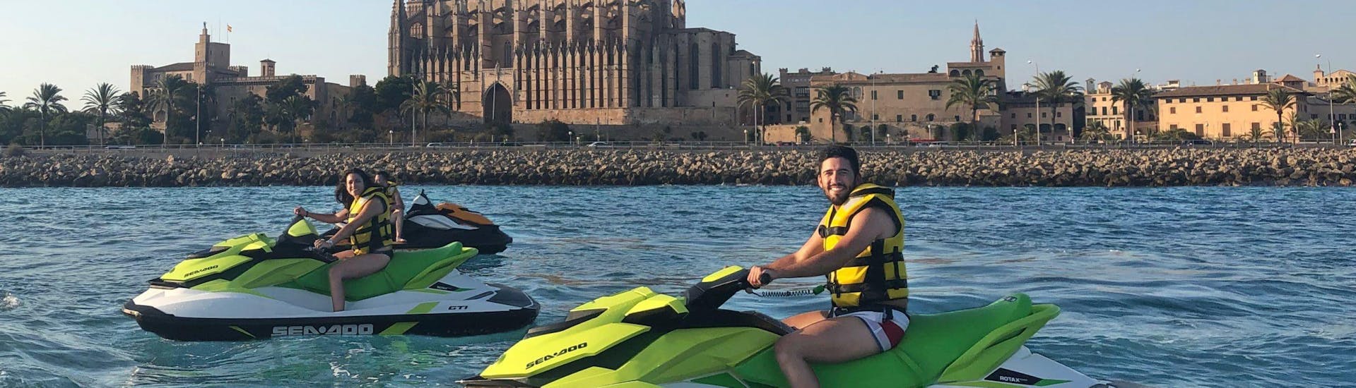 A group of people go on a safari jetski to the Cathedral of Palma with Mallorca on Jetski.