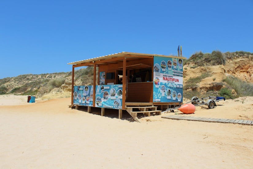 Nautifun Galé Albufeira. Small beach house displaying the provider's activities on posters 