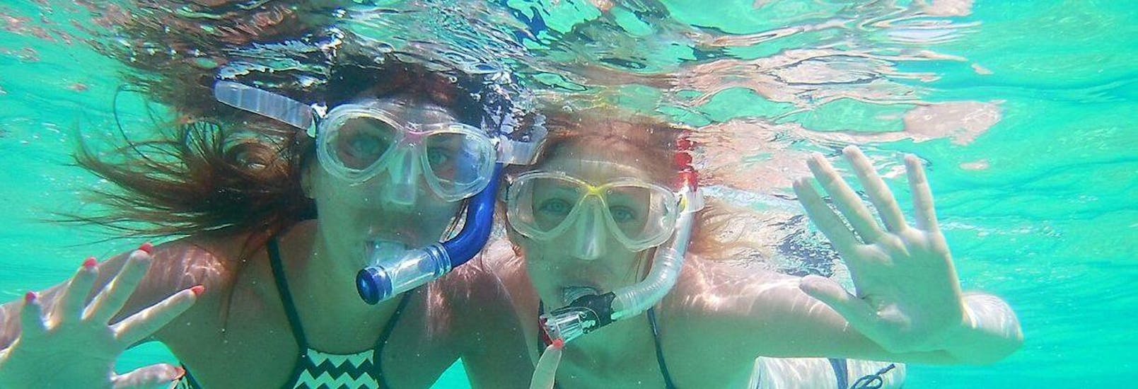 Girls doing snorkeling and diving in Chania with Omega Divers. 