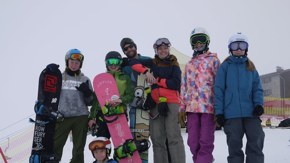 Happy snowboarders during lessons in the school Out of Bounds Snowboard School in the beautiful ski resort Oberstdorf.