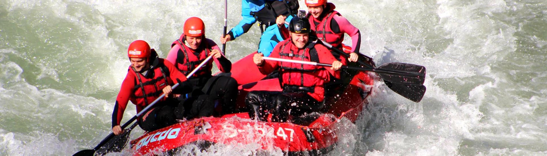 The participants of the Rafting Tour "Wild Water" are conquering the high waves an rapids of Salzach river together with an experienced guide from Outdo Zell am See Rafting & Canyoning.