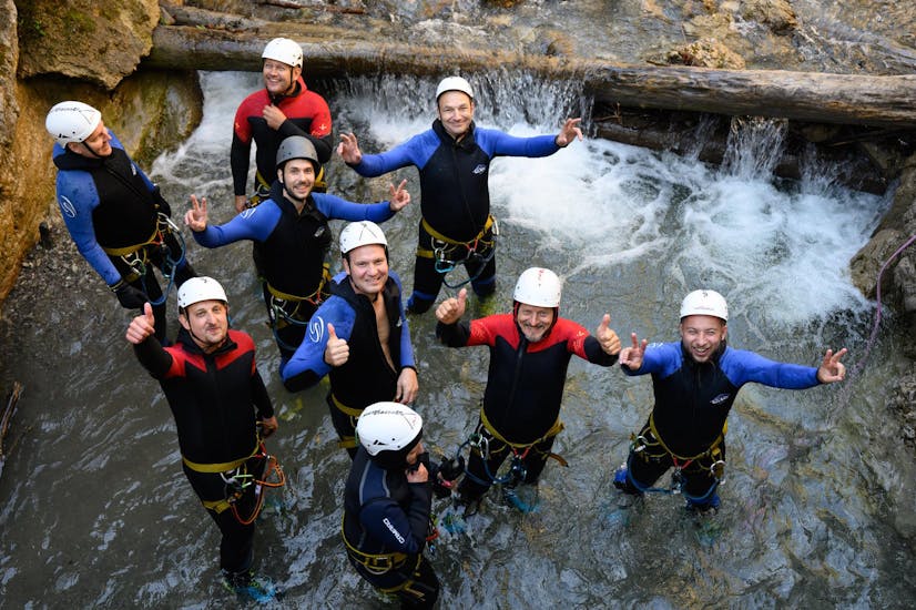 Clients smiling at the camera during their canyoning adventure.