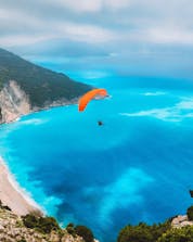 An arial photo of a breathtaking landscape above the greek ocean where you can do paraglidin gin Kafalonia.