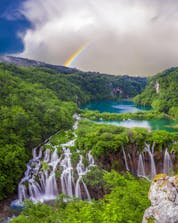 A breathtaking view of the waterfalls in Croatia where you can do paragliding near the Plitvice Lakes.