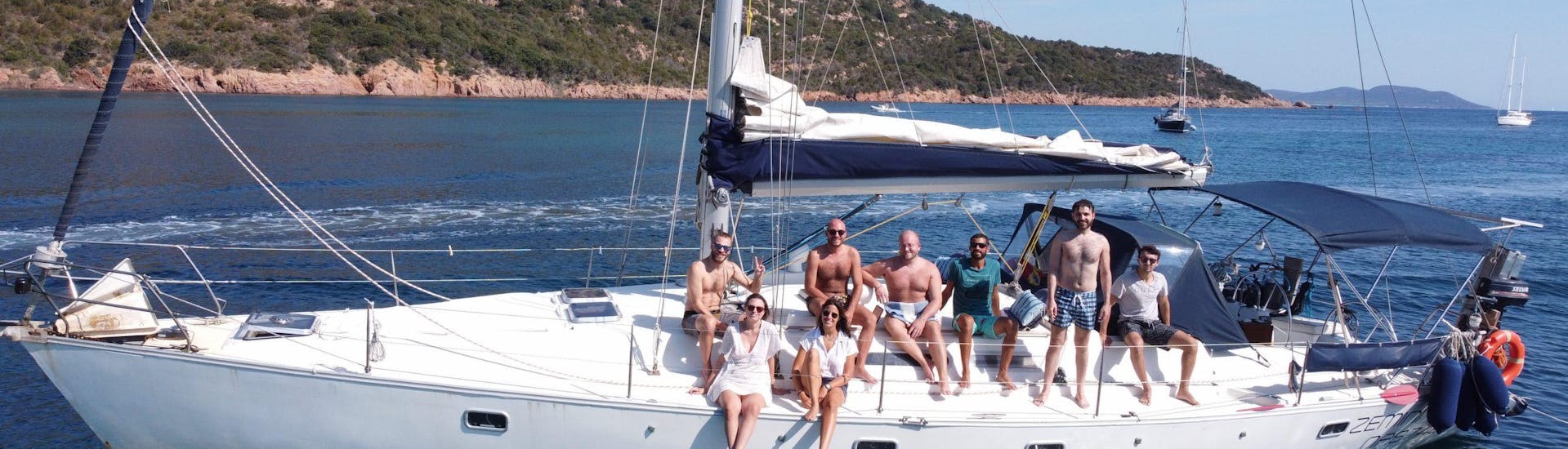 Our sailboat sailing through Sardinian waters during a trip with Sailing in Sardinia.
