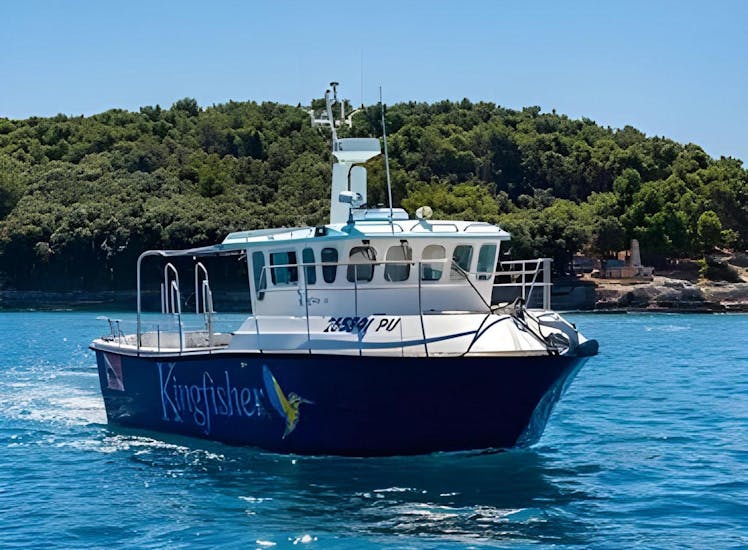 One of the Boats from Pula Boat Tours Croatia on the water, ready to leave for its trip along the coast of Pula. 