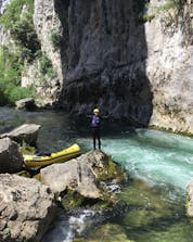 A young men celebrating the end of his sport tour in Croatia where you can do rafting in Omis.