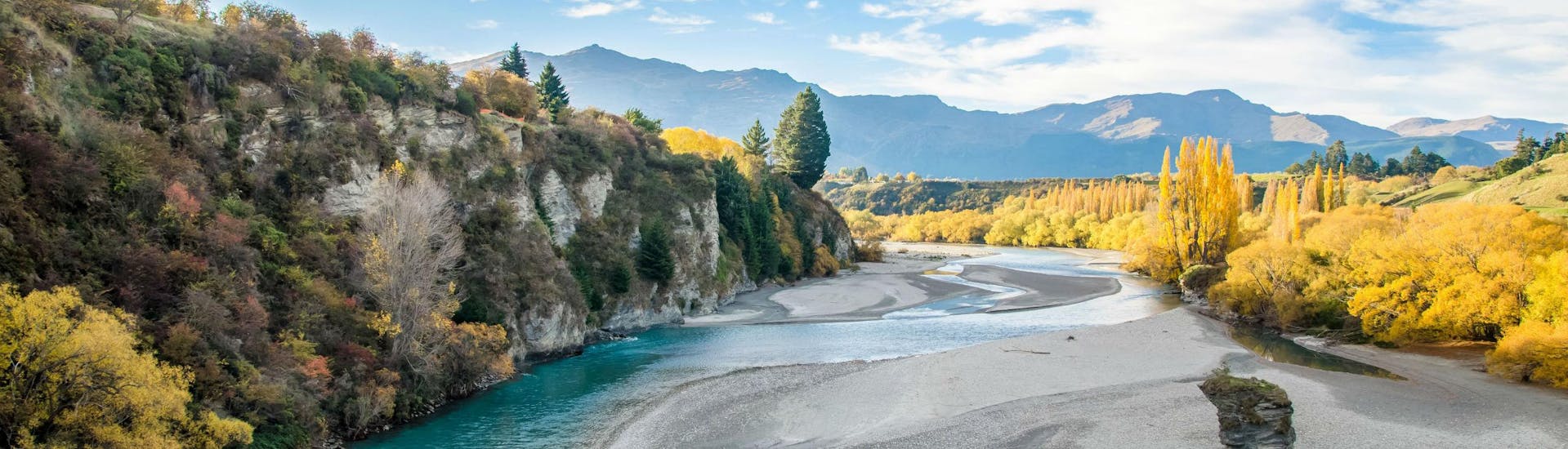 A view of the beautiful Shotover River that visitors paddle along when rafting in Queenstown.