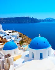 A view from Oia on to the deep blue waters of the Aegean Sea that invite visitors from all over to go scuba diving in Santorini.