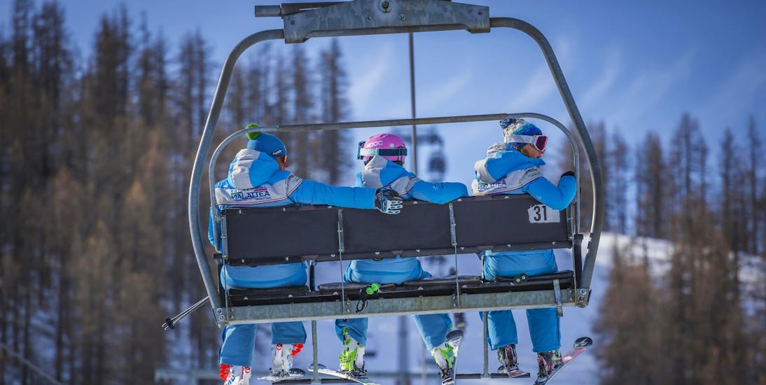 Ski instructors on a chair lift in Sauze d'Oulx.