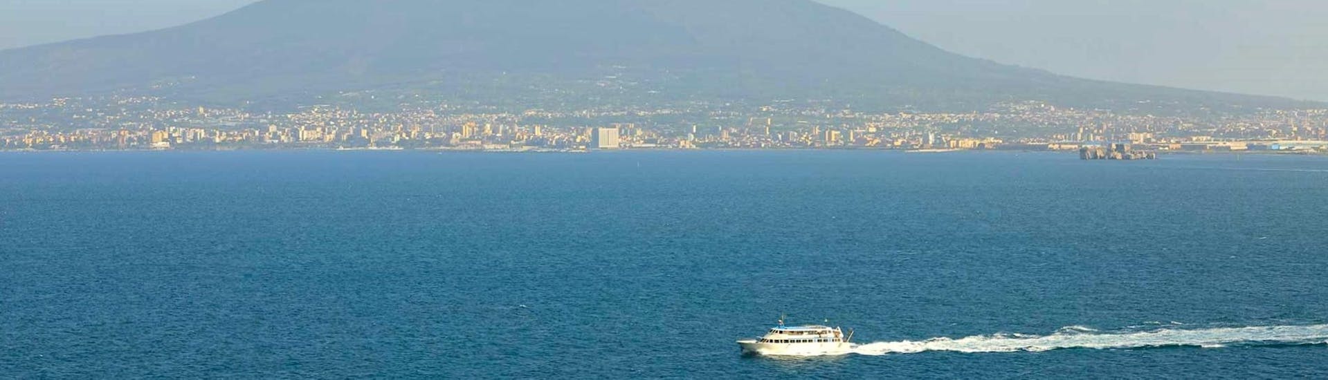 The boat Benedetta II is navigating along the Sorrento Coast.