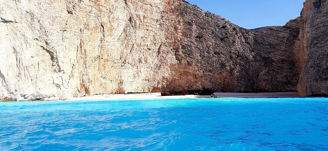 Golden Dolphin Speedboats Alykes Beautiful landscapes showcasing mountains and sea, where the experiences of Golden Dolphin Speedboats Alykes are taking place.