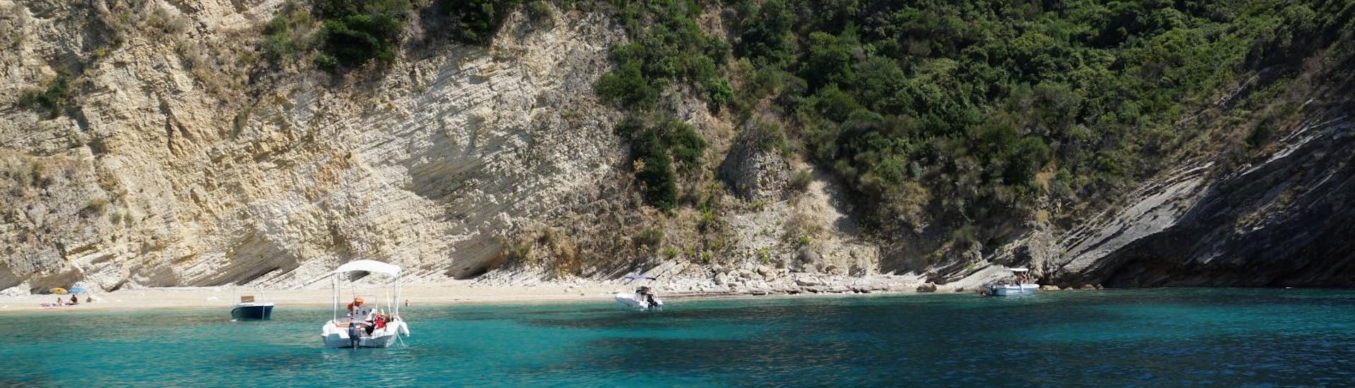 In front of a beautiful coast with a boat from  Ski Club 105 Boat Rental Corfu.