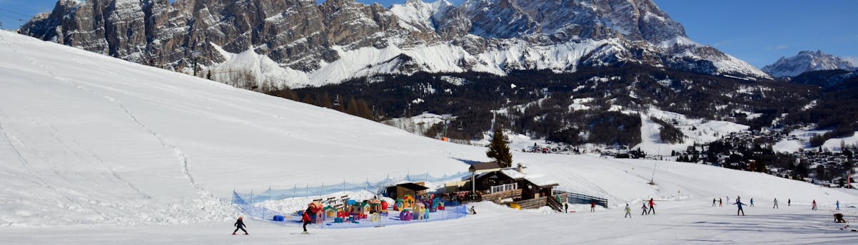 ski-school-alleghe_SEM-Resort-Hero View of a kinderland in Alleghe in the Ski Civetta ski resort, where local ski schools offer their ski lessons.