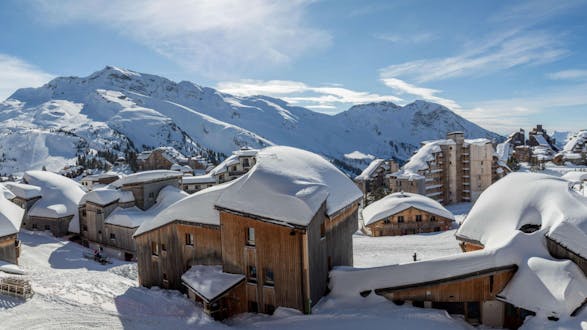 A panoramic view of the snow-covered mountain huts and hotels in the French ski resort of Avoriaz, where local ski schools offer a wide selection of ski lessons. 