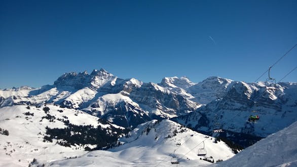 An image of the Dents du Midi close to the Swiss town of Champéry, a popular ski resort where visitors can book ski lessons with one of the local ski schools.