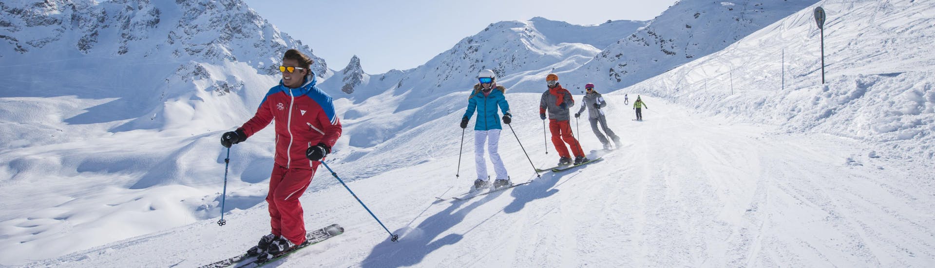 A group of skiers enjoy a day out in the slopes of the Courchevel 1550 ski resort in France where ski schools offers their ski lessons.