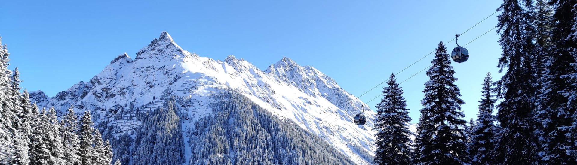 Image of a ski lift going up to the slopes in the ski resort Gargellen in Austria.