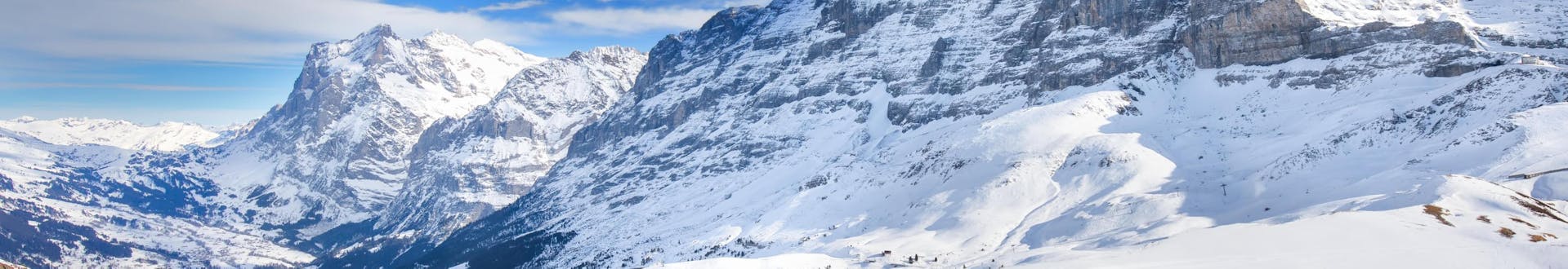 View of the snowy slopes of Grindelwald in the Jungfrau region, where many ski schools offer their ski lessons.