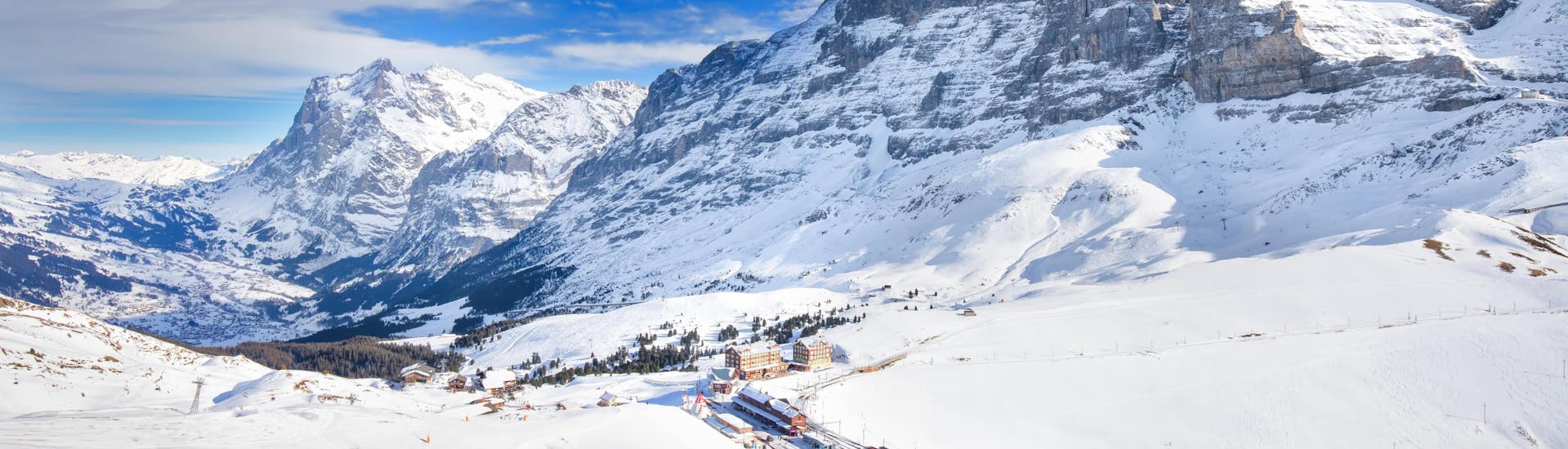 View of the snowy slopes of Grindelwald in the Jungfrau region, where many ski schools offer their ski lessons.