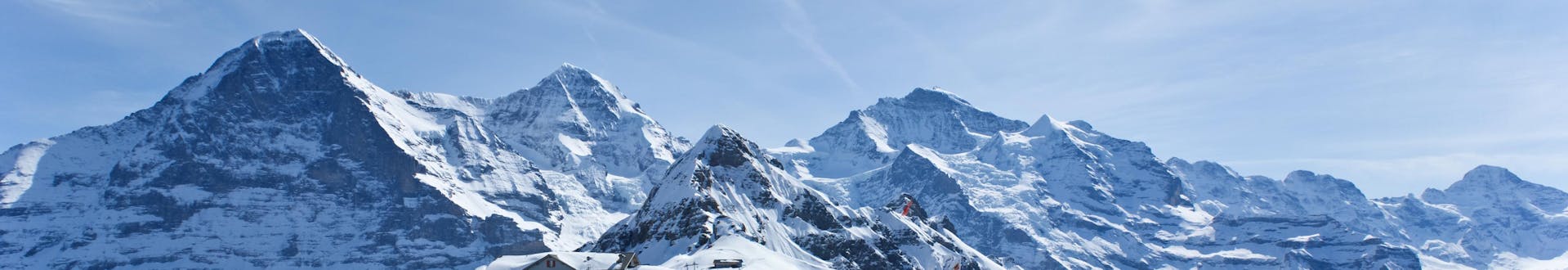 View of the snowy mountain landscape surrounding the mountain station of the cable car in the swiss ski resort of Interlaken.