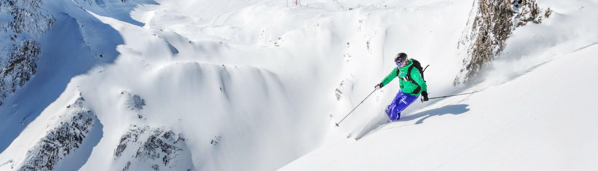 A skier is riding through some fresh powder snow in the Austrian ski resort of Kaprun, where beginners as well as advanced skiers can book ski lessons with the local ski schools.