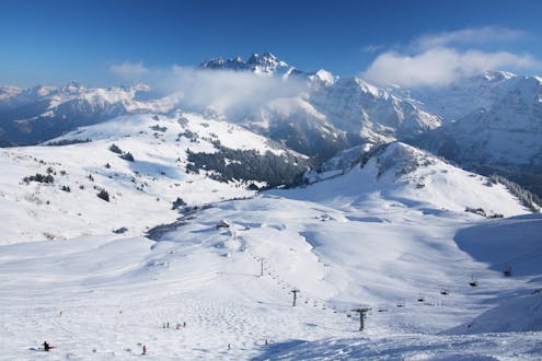 A view of the snowy slopes of the Swiss ski resort Les Crosets where local ski schools offer a wide range of ski lessons to those who want to learn to ski.