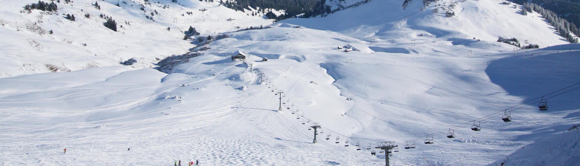 A view of the snowy slopes of the Swiss ski resort Les Crosets in the Les Portes du Soleil ski area where local ski schools offer a wide range of ski lessons to those who want to learn to ski.