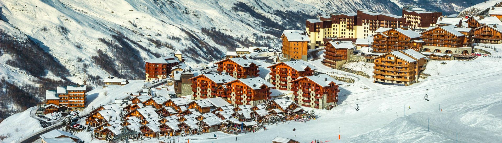 A view of the French ski resort of Les Menuires in the Les Trois Vallées ski region, where local ski schools offer ski lessons for snow sports enthusiasts who want to learn to ski.