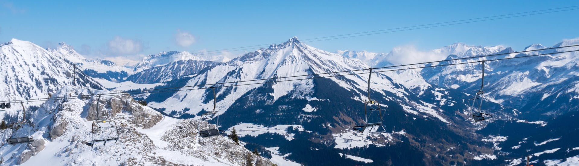 An image of several skiers riding down one of the ski slopes in the Swiss ski resort of Leysin, a popular destination for aspiring skiers who wish to learn to ski by taking ski lessons with one of the local ski schools.