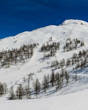 A view of the ski pistes of Sestriere, where the local ski schools offer a broad selection of ski lessons.
