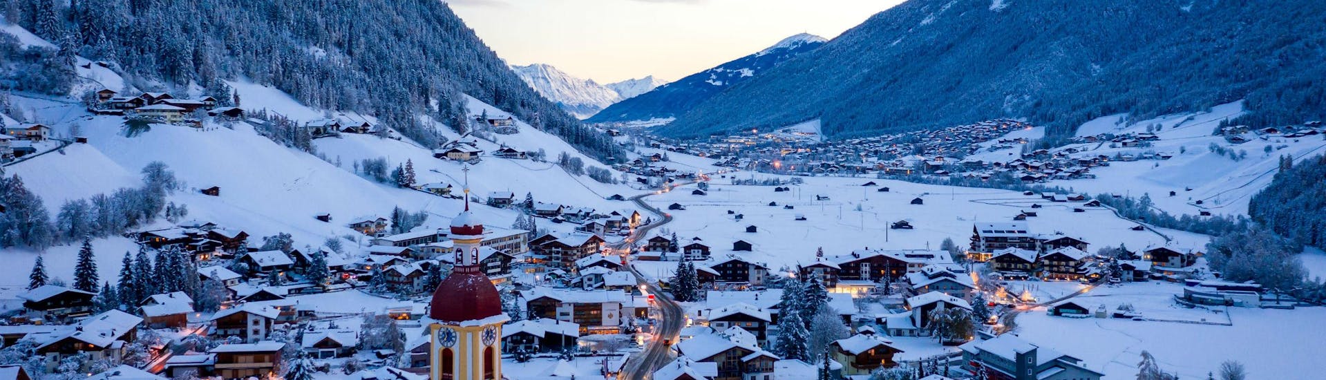 An image of the the tyrolean village of Neustift in the Stubai Valley, where local ski schools offer ski lessons to those who want to learn to ski.