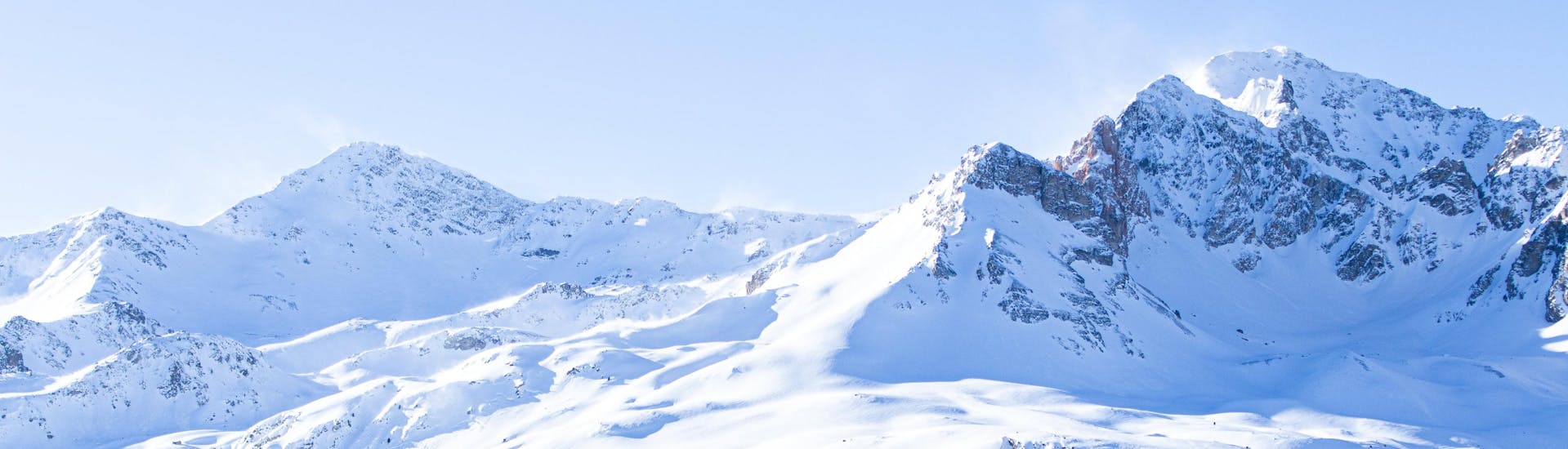 A scenic view of the snow-capped mountains surrouding the French ski resort of Valfréjus where local ski schools offer a large choice of ski lessons.