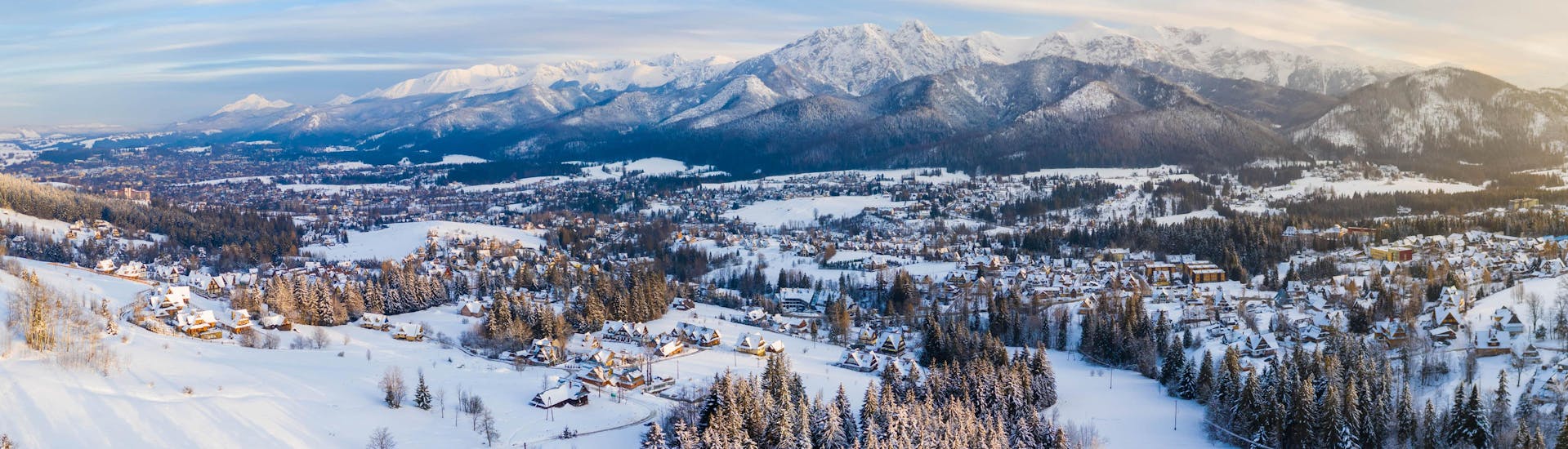 View of the snowy landscape of the village of Zakopane, where local ski schools offer their ski lessons.