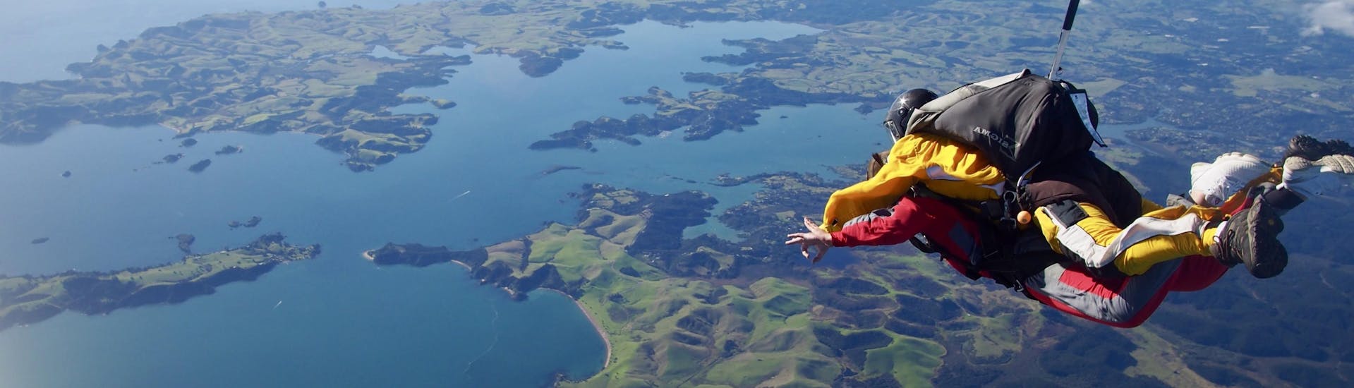 A participant of the skydive organized by Skydive Bay of Islands is living the time of her life in Bay of Islands.