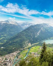 A beautiful view from the valley where you can do skydiving in Interlaken.