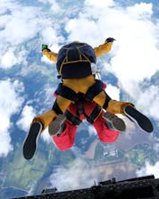 A tandem master and his student are pictured in the moment they jump from the plane while skydiving in Normandy.
